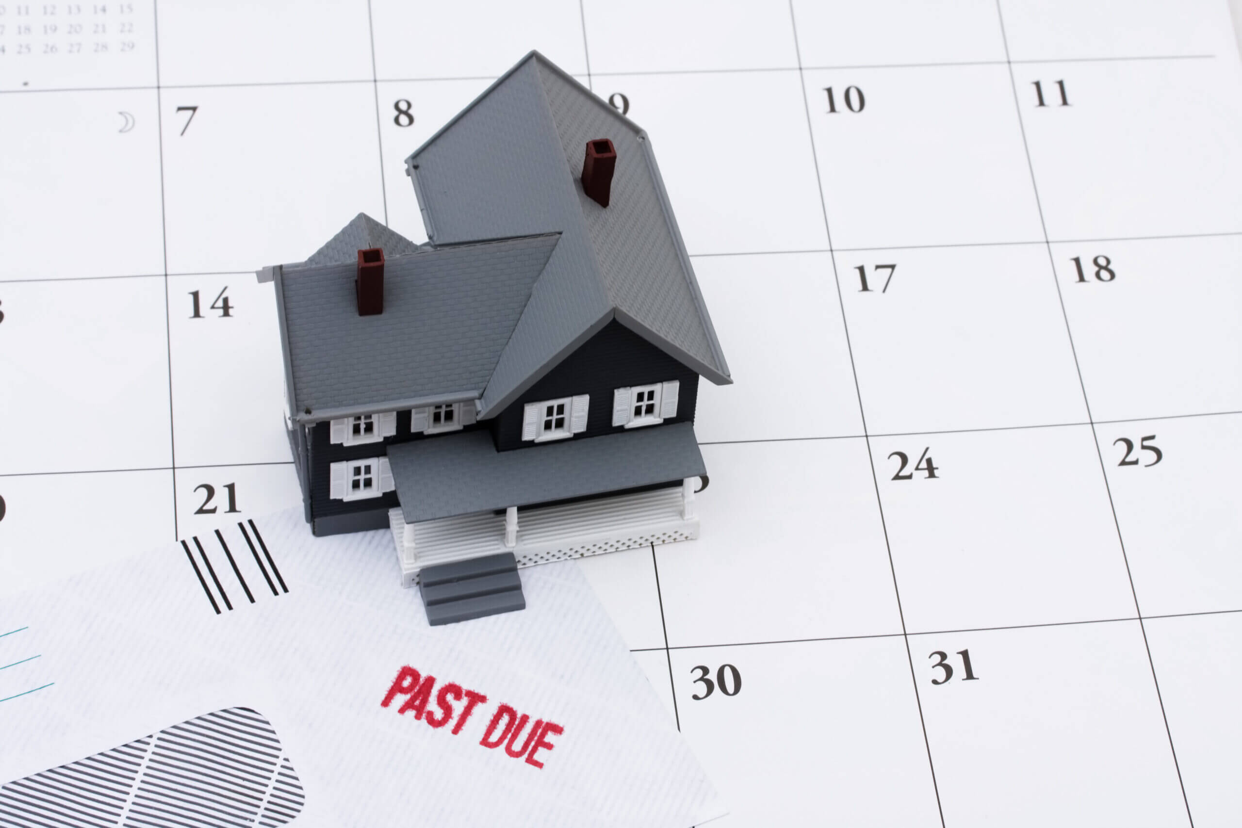 Illustration of House on Top of Past Due Bill and Calendar | Housemax