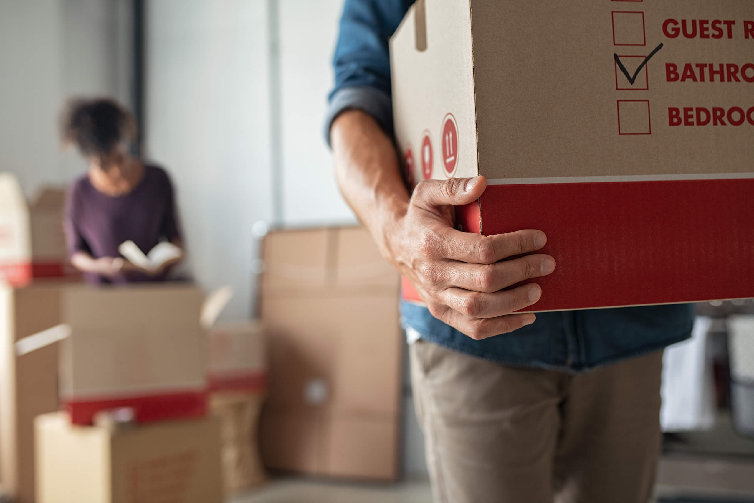 Close Up of Man Carrying Moving Boxes | Housemax
